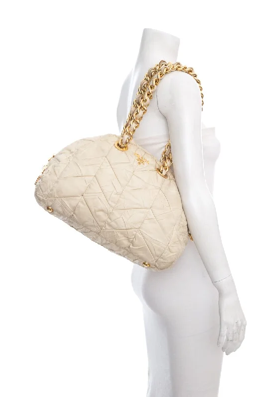 Prada bags with a zippered interior pocket for separating itemsPrada Cream Quilted Puff Nylon Handbag