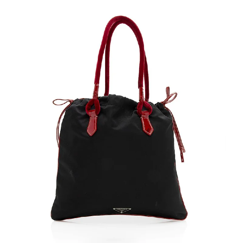 Prada Cleo bags with a snakeskin - effect panel for a bold and trendy lookPrada Tessuto Bow Small Tote (SHF-12491)